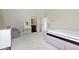Light-filled bedroom with ensuite access, dressing table, and stylish decor at 1333 Chatham Rdg Ct, Westfield, IN 46074