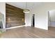 Airy bedroom features a modern wood panel accent wall and a door to en-suite bath at 1333 Chatham Rdg Ct, Westfield, IN 46074