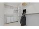 Walk-in closet features built-in shelving, cabinets, and neutral decor at 1333 Chatham Rdg Ct, Westfield, IN 46074