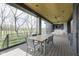 Covered patio with view of large yard, golf course and water feature at 1333 Chatham Rdg Ct, Westfield, IN 46074