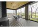 View of a covered patio with ceiling fan, outdoor kitchen area and view of the backyard at 1333 Chatham Rdg Ct, Westfield, IN 46074
