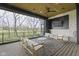Covered patio with outdoor seating area, ceiling fan, and a view of the backyard at 1333 Chatham Rdg Ct, Westfield, IN 46074