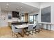 Dining room with a long dining table, modern lighting, and access to the outdoors at 1333 Chatham Rdg Ct, Westfield, IN 46074