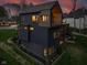Modern home with a spacious backyard and dark exterior at 1333 Chatham Rdg Ct, Westfield, IN 46074