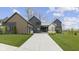 Beautiful exterior of this two-story home with concrete driveway, manicured lawn, and modern design at 1333 Chatham Rdg Ct, Westfield, IN 46074