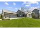 Stunning exterior elevation of this modern home with well manicured yard and three-car garage at 1333 Chatham Rdg Ct, Westfield, IN 46074