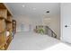 Open hallway features a bookshelf, bench, modern light fixture and soft carpeting at 1333 Chatham Rdg Ct, Westfield, IN 46074