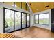 Bright living room featuring hardwood floors, expansive windows, and vaulted wooden ceilings at 1333 Chatham Rdg Ct, Westfield, IN 46074