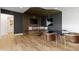 Modern living room featuring a custom bench, hardwood floors, and stylish decor at 1333 Chatham Rdg Ct, Westfield, IN 46074