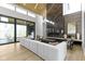 Bright, open living room with hardwood floors, fireplace, and expansive windows at 1333 Chatham Rdg Ct, Westfield, IN 46074