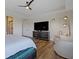 Comfortable main bedroom featuring a modern fan, a sitting area, and dresser with television at 1333 Chatham Rdg Ct, Westfield, IN 46074