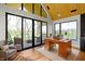 Bright office with expansive windows, a desk, and access to a balcony with golf course views at 1333 Chatham Rdg Ct, Westfield, IN 46074