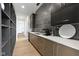 Modern pantry with custom cabinets, designer backsplash, sink and elegant countertops at 1333 Chatham Rdg Ct, Westfield, IN 46074