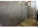 Modern shower with stone tile and rain shower head at 1333 Chatham Rdg Ct, Westfield, IN 46074