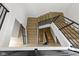Stylish staircase with modern black metal railings and natural wood steps leading to multiple levels of the home at 1333 Chatham Rdg Ct, Westfield, IN 46074