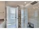 Bright bathroom with walk in glass shower and modern fixtures with natural light at 13392 Dorster St, Fishers, IN 46037