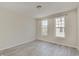 Bright bedroom featuring wood floors and two windows at 13392 Dorster St, Fishers, IN 46037