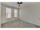 Bright bedroom featuring carpet floors and two windows at 13392 Dorster St, Fishers, IN 46037