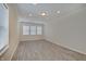Bonus room featuring wood-look floors, and multiple windows with natural light at 13392 Dorster St, Fishers, IN 46037