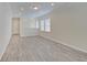 Large bonus room with wood-look floors and lots of natural light at 13392 Dorster St, Fishers, IN 46037