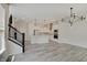 Open concept living space with a staircase and an open kitchen area at 13392 Dorster St, Fishers, IN 46037
