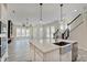 Open-concept kitchen with stainless steel sink, countertops and appliances at 13392 Dorster St, Fishers, IN 46037