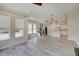 Open-concept living area with view of the kitchen and staircase at 13392 Dorster St, Fishers, IN 46037