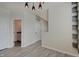 Bright living room featuring wood floors, multiple doorways, and built in storage at 13392 Dorster St, Fishers, IN 46037