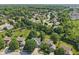 This aerial shot shows a home and its neighborhood in a lush, green setting at 13562 Silver Spur, Carmel, IN 46032