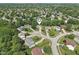 A high angle shows the home sitting in the middle of a cul-de-sac at 13562 Silver Spur, Carmel, IN 46032
