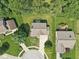 Overhead shot of a home with a walkway, driveway, trees, and lush landscaping at 13562 Silver Spur, Carmel, IN 46032