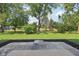 A view of backyard landscaping with stone patio at 13562 Silver Spur, Carmel, IN 46032