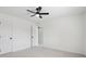 Neutral carpeted bedroom with ceiling fan and access to ensuite at 13562 Silver Spur, Carmel, IN 46032