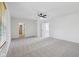 Spacious, carpeted bedroom with ceiling fan, and views of a closet and bathroom at 13562 Silver Spur, Carmel, IN 46032