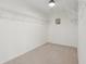 Walk in closet featuring plenty of shelving and carpeted floors at 13562 Silver Spur, Carmel, IN 46032