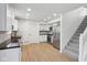 Bright, updated kitchen features stainless steel appliances, butcher block countertops, and modern cabinetry at 13562 Silver Spur, Carmel, IN 46032
