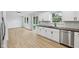 Modern kitchen featuring bright white cabinets, stainless steel appliances and beautiful counters at 13562 Silver Spur, Carmel, IN 46032
