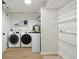 Bright laundry room with shelving, new washer/dryer, and lots of room for storage at 13562 Silver Spur, Carmel, IN 46032