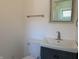 Bright bathroom featuring a vanity with storage, a square mirror, and a toilet at 1378 Hannibal St, Noblesville, IN 46060