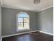 Bedroom featuring a large window, grey walls, and dark hardwood floors at 1378 Hannibal St, Noblesville, IN 46060