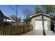 Backyard featuring a detached garage with a white door and a wooden fence, providing secure parking and storage at 1378 Hannibal St, Noblesville, IN 46060
