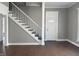 Living room with stairs, hardwood floors and a gray and white decor at 1378 Hannibal St, Noblesville, IN 46060