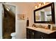 Elegant bathroom with a spacious vanity, stylish mirror, and a walk-in shower, creating a luxurious and relaxing atmosphere at 1404 Broadway St # Apt G, Indianapolis, IN 46202