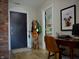 Welcoming entryway features a modern design with a rustic brick accent wall and stylish decor, blending comfort and sophistication at 1404 Broadway St # Apt G, Indianapolis, IN 46202
