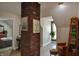 Cozy living area with exposed brick, stylish decor, and comfortable seating, creating a warm and inviting space at 1404 Broadway St # Apt G, Indianapolis, IN 46202
