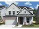 Charming two-story home featuring a brick and siding exterior, attached two car garage, and beautifully landscaped yard at 14223 Coyote Ridge Dr, Noblesville, IN 46060