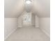 Bright, finished attic with clean, neutral colored carpet at 1429 Fletcher Ave, Indianapolis, IN 46203