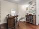 Stylish bar area features custom cabinets, hardwood floors, and staircase at 1429 Fletcher Ave, Indianapolis, IN 46203