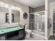 Modern bathroom with glass enclosed shower, double sink, and stylish vanity with great lighting at 1429 Fletcher Ave, Indianapolis, IN 46203