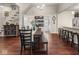 Bright and airy dining area with a rustic table, stylish seating, and access to the kitchen, perfect for Gathering gatherings at 1429 Fletcher Ave, Indianapolis, IN 46203